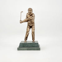 An 8 inch high golf trophy of a man going for a chip shott