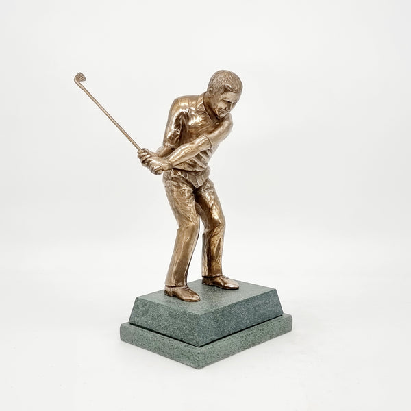 An 8 inch high golf trophy of a man going for a chip shot. Our bandit trophy, in spite of its connotations, is very popular indeed. Always received with a smile, and given out with the utmost pleasure and applause from competitors and menbers alike. In spite of the simplicity of form, it contains some lovely unexpected detail. The moustache hiding under the sombrero, the zig-zag pattern in the hat brim the sharp v-neck on the poncho all contribute to its delight