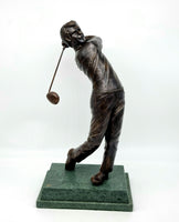 In patinated bronze, this outstanding portrait of Tony Jacklin in action is by artist Ellinor Atkinson. Based on his win at the US Open in 1970 it captures a true champion who lit up British and European golf as no one had for many years. It captures the power of the shot and the class of the man.