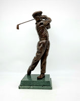 Golf trophy, portrait of Ben Hogan, 13 inches tall, patinated bronze.  This superb sculpture shows a classic stroke by the famousBen Hogan. The timeless, patinated finish - like that used on the lions of Trafalgar Square - lifts the figure to a new status.