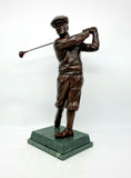 Bobby Jones 13" Patinated on a two tier base This figure of Bobby Jones is a beautiful piece of sculptural skill and a fitting tribute to the great man. How can a man who so laid back be so successful? It is also an outstanding example of the golfer's wardrobe which any player of the time would not be without.